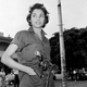 A young unidentified woman patrols near a headquarters building in Havana, Jan. 4, 1959.